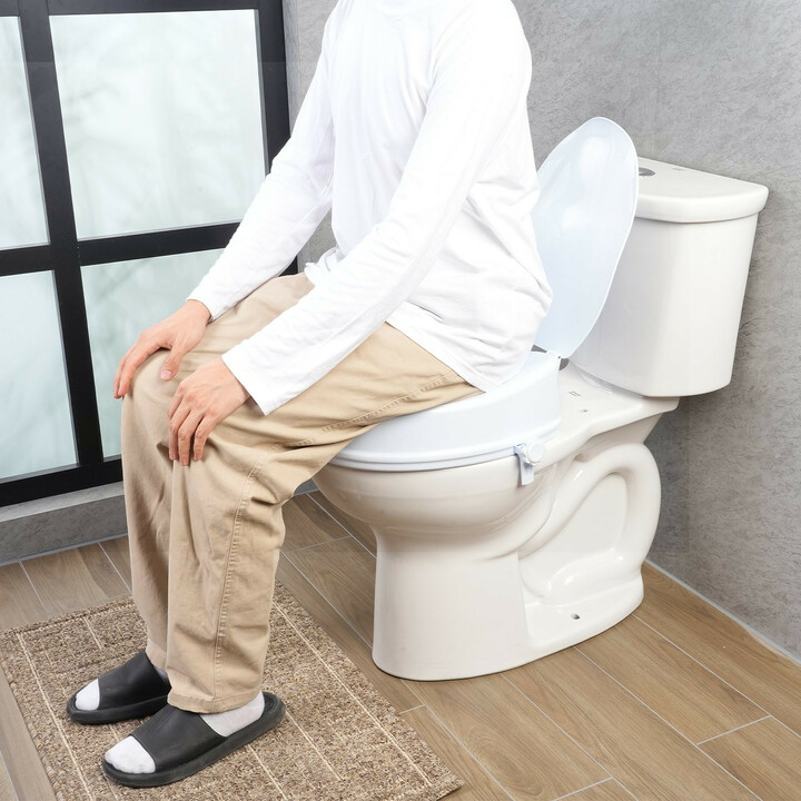 Korotettu wc-istuin 100 mm universaali, lukitusruuvit, mukana istuinkansi, kantavuus 136 kg
